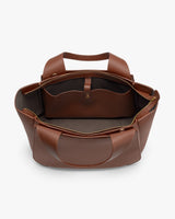 Open travel bag with an internal pocket and handles