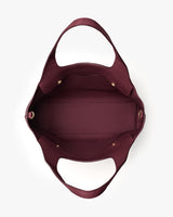 Top-down view of an open tote bag with two handles and a spacious interior.