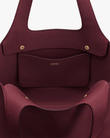 Open tote bag with an inner pocket and gold button snaps