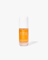 A bottle of skincare with white cap standing upright.