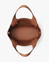 Top view of an open handbag showing the interior.