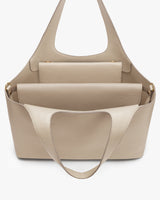 Handbag with a small pouch attached inside.