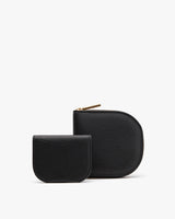 Two small pouches, one larger than the other, both with zippers.