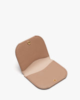 Empty open wallet on a plain background