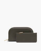 Two small zippered pouches on a light background.