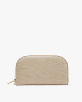 Small zippered pouch with a textured exterior on a plain background.