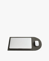 Laptop and mouse on a flattened laptop sleeve.