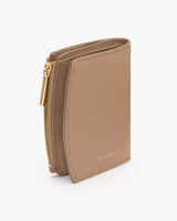 A compact wallet with multiple card slots and a zippered section.