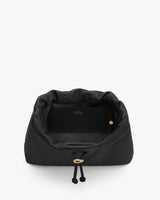 Open bag showing interior compartments and drawstring closure.