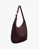 Shoulder bag with a rounded shape and adjustable strap