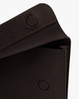 Pebbled leather flap with two snap buttons