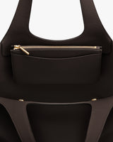 Open handbag with visible inner detachable zipper pouch.