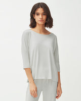Woman standing in a relaxed pose wearing a casual outfit.