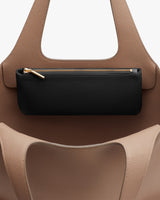 Handbag with a small pouch attached to the handle.