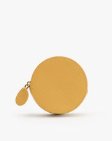 Round coin purse with a textured surface and a small attached zipper.