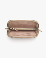 Open wallet with multiple compartments and a zipper closure.