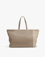 Large tote bag with two handles standing upright.