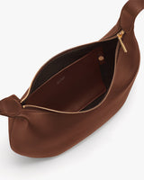 Open handbag with zipper and visible interior pocket.