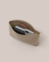 Open pouch with phone, wallet, and other small items inside