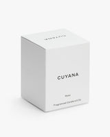 Box of Cuyana Rosa scented candle on a plain background.