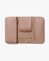 Open leather wallet with various compartments and zippers