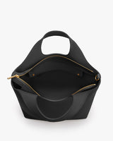 Open handbag with visible inner pocket and two small handles
