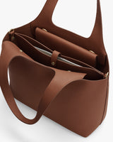 Open handbag with compartments and a flap pouch inside