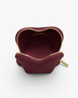 Small open pouch with visible interior and zipper trim