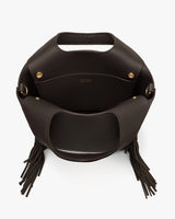 Open top view of a fringed handbag with a handle and gold snaps.