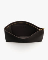 Open zippered toiletry bag with visible interior pocket.