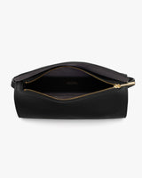 Open handbag with a visible zipper and interior pocket