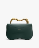 Handbag with curved metal handle and logo on front.