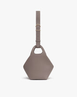 Hexagonal handbag with round handles and adjustable strap