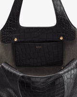 Tote bag interior with croc-embossed leather and a small pocket.