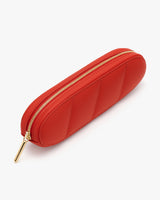 Pencil case with a zippered closure and quilted design.