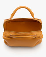 Small handbag with a zippered top handle and wide opening