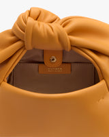 Open handbag with label inside showing the brand.