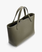 Tote bag with handles on a flat surface.