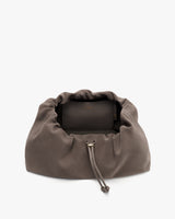 Drawstring pouch with a small purse inside.