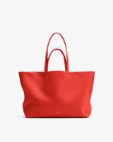Large tote bag with two handles on display.