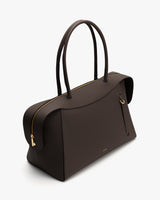 Handbag with two handles and a zipper closure.