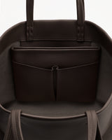 Open bag with pockets and handles visible.