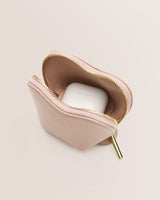 Small zippered pouch holding a wireless earbud case.