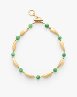 Beaded bracelet with alternating oval and round shapes and a clasp.