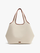 Hexagonal tote bag with dual handles.
