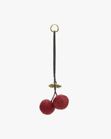 Cherry-shaped keychain with two cherries and a leaf.