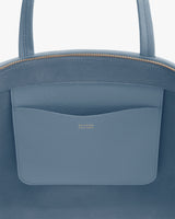 Close-up of a travel bag with a small outer pocket.