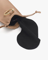 Open drawstring pouch with fabric lining visible inside.