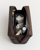 Toiletry bag containing various grooming products.