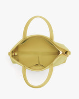 Open top view of a handbag with multiple compartments
